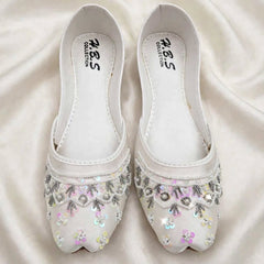 Ivory Rosette Bridal Khussa on fabric background, Her Footwear Pakistan